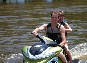 jetskiing with girl behind dad